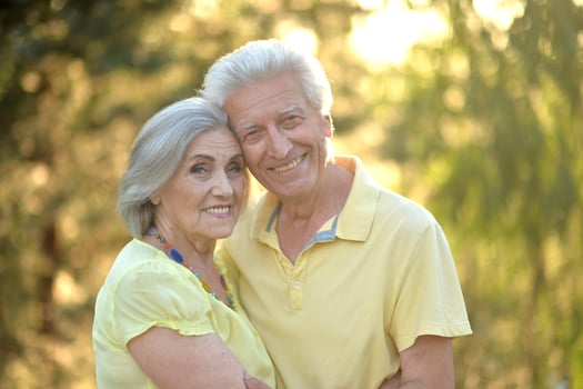 Loving mature couple in the park in summer photo