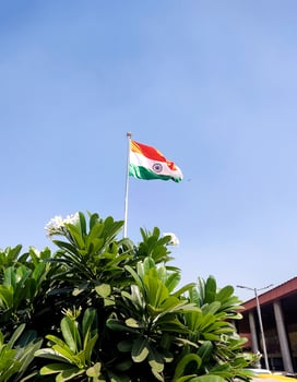 Indian flag waving outside New Delhi Railway Station photo