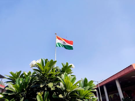 Indian flag waving outside New Delhi Railway Station photo
