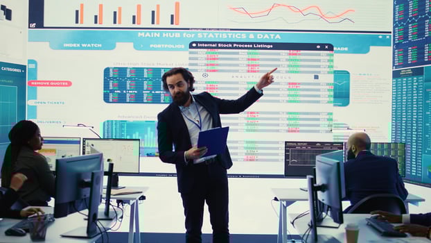 Teammates and manager assembling in a big data room to go over their results, examining graphic representations with feedback from shareholders investors. Exchanging perspectives. Camera B. photo