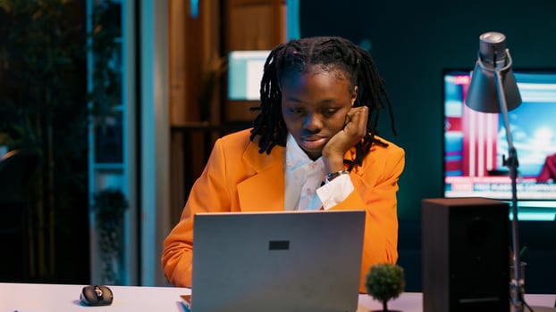 Student working under pressure to finish homework at midnight, trying to respect deadline. Girl rubbing eyes and solving tasks while feeling exhausted, dealing with burnout syndrome. Camera A. photo
