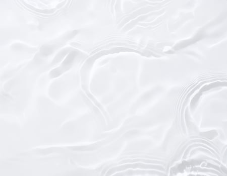 a white background with waves and ripples photo
