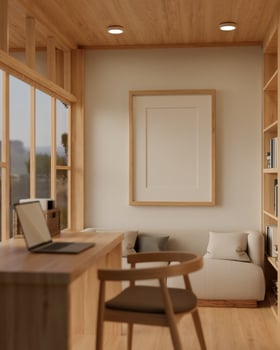 A minimal wood picture frame mockup on a white wall in a modern cosy, Scandinavian room. photo