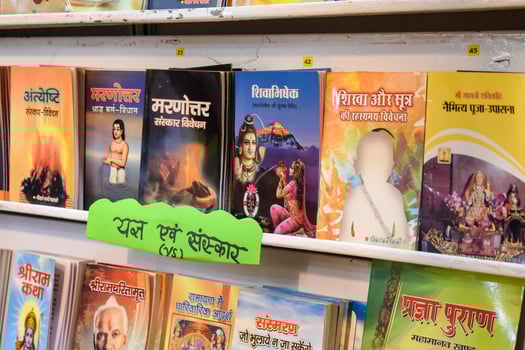 New Delhi, India, February 17 2024 - Variety of Books on shelf inside a book-stall at Delhi International Book Fair, Selection of books on display in Annual Book Fair at Bharat Mandapam complex photo