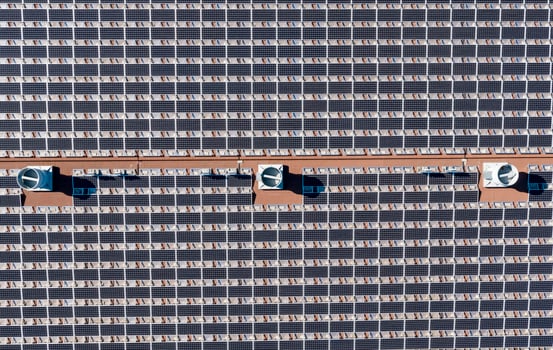 Aerial View of a Large Solar Panel Array on a Sunny Day photo