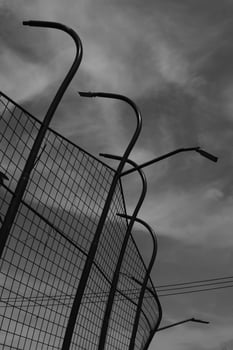 Black and white iron fence against the sky. Monochrome of exterior on public park. Graphic Resources. Monochrome Background Photography. Light Shadow Photography Concept. photo