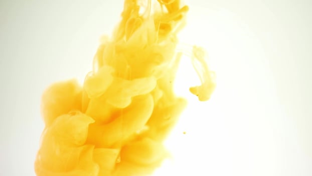 yellow colored smoke on a white background photo