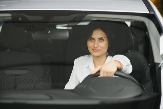 business woman in her new car photo