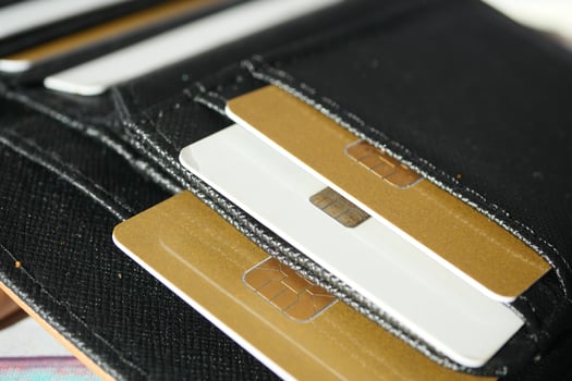 close up of credit cards in a wallet on wooden background photo