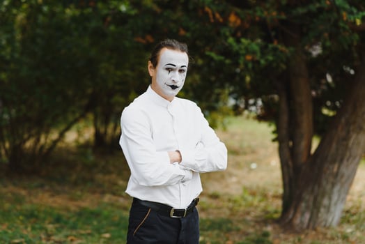 Portrait of a man, artist,clown, MIME. Shows something. Mime actor shows different emotions. photo