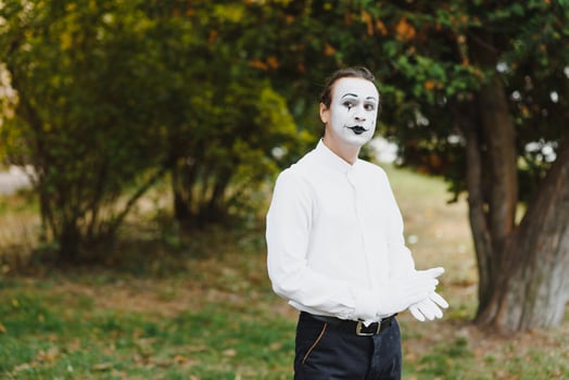 Portrait of a man, artist,clown, MIME. Shows something. Mime actor shows different emotions. photo