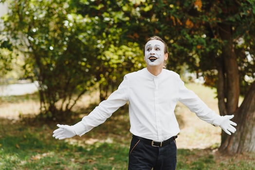 Portrait of a man, artist,clown, MIME. Shows something. Mime actor shows different emotions. photo