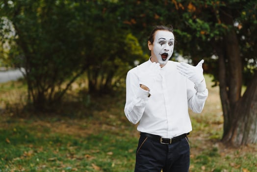 young Funny mime shows something. photo