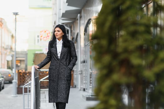 Attractive young woman in the city. Business lady photo