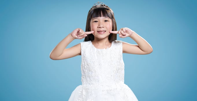 Little princess in white dress smiling photo