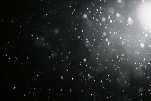 Falling snowflakes on dark background. photo