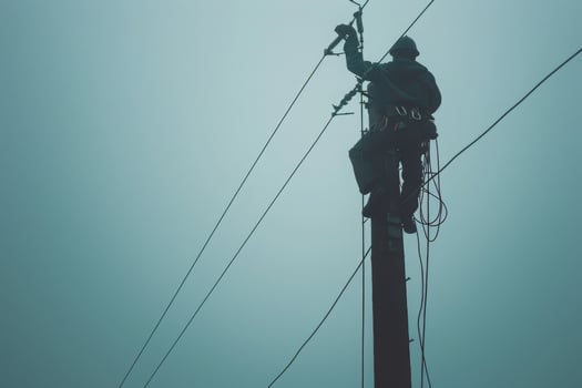 Electrician Working on a Power Pole photo