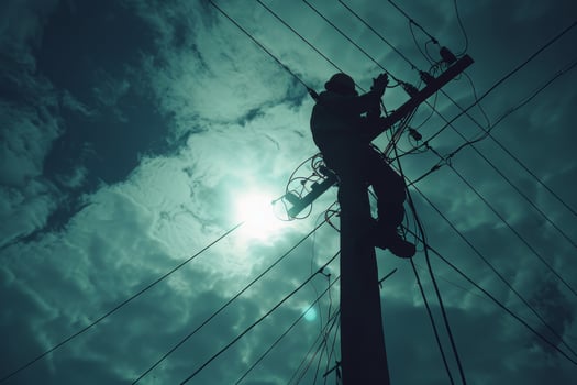 Electrician Working on a Power Pole photo