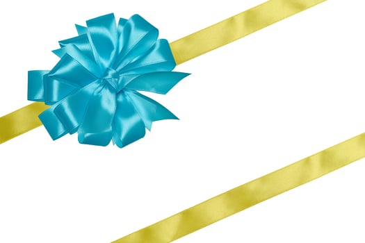 Yellow silk ribbon and a tied big blue bow on an isolated background, top view. Gift packaging photo