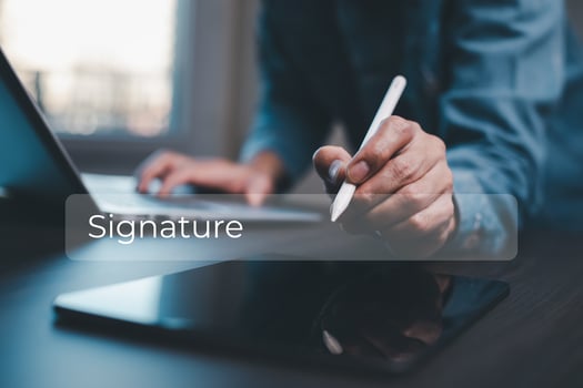 Businessman signing electronic signature, smart contract paperless office,Electronic Signing Businessman signs electronic documents on digital documents on virtual laptop screen using stylus pen photo