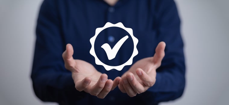 Quality assurance of business services, Businessman Hand shows the sign of the top service Quality assurance in Black background , Guarantee, Standards, ISO certification and standardization concept. photo