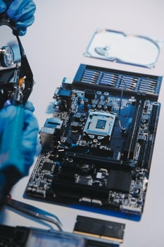 Close up of Technician measuring voltage electronic circuit board television, Service after sale fix electric equipment within insurance. photo
