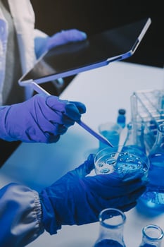 chemist,scientist hand dropping chemical liquid into test tube, science research and development concept photo
