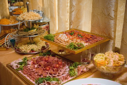Meat and cheese appetizers. Antipasti and catering platter with different meat and cheese products. photo