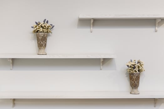 shelves with decor on a white background, place for text photo