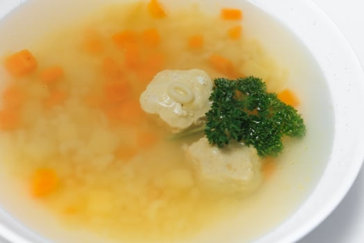 Bean soup with meatballs, vegetables and dill photo