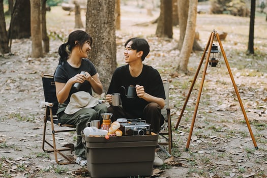 Asian couple sweet in tent inside on they camping trip, traveller relax and sleep togather in out door and camping trip photo