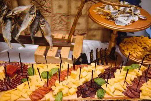 Meat and cheese appetizers. Antipasti and catering platter with different meat and cheese products. photo