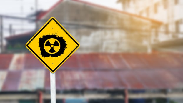 Yellow radioactive sign on blur background photo