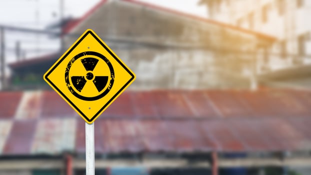 Yellow radioactive sign on blur background photo