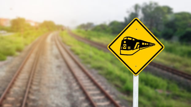 Train warning sign to warn people when crossing the train tracks photo