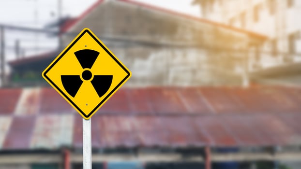 Yellow radioactive sign on blur background photo