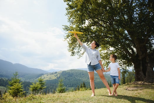 Mother and son having a great time together, traveling in the mountains photo