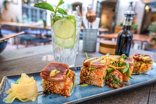 Overhead view of platter of sushi rolls photo