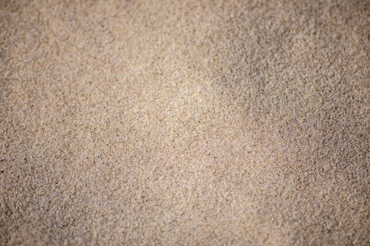 Close Up View Of Fine Sand Grains On A Beach photo