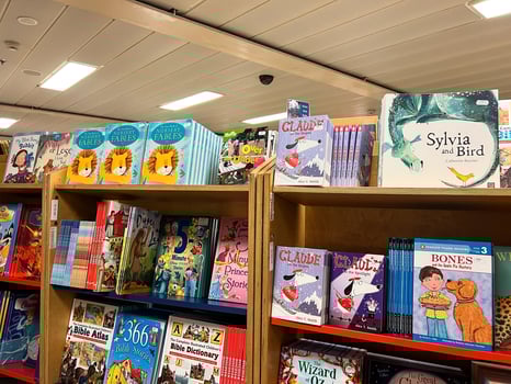Herceg-Novi, Montenegro - 17 august 2023. Colorful books with fairy tales for children in hardcovers stand on the shelves in a bookstore photo