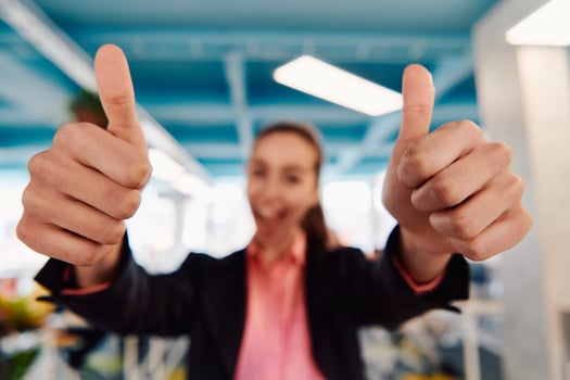 Closeup of hands, Smiling Business Woman Making Frame Gesture with at modern bright coworking open space startup office photo