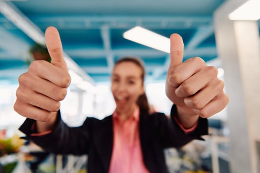 Closeup of hands, Smiling Business Woman Making Frame Gesture with at modern bright coworking open space startup office photo