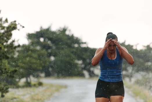 Unstoppable. A Determined Athlete Trains Through the Rain in Pursuit of Marathon Glory photo