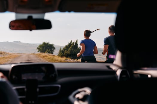 Romantic Couple Running Outside, Captured from Car photo