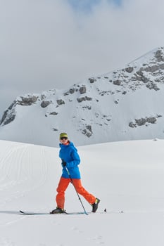A Skier Scales a Treacherous Alpine Peak photo