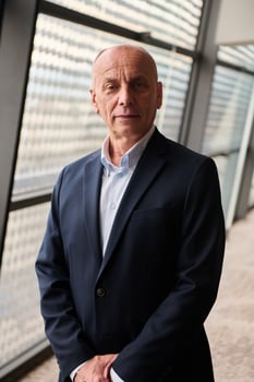 Portrait of an Experienced Businessman in Modern Conference Setting photo