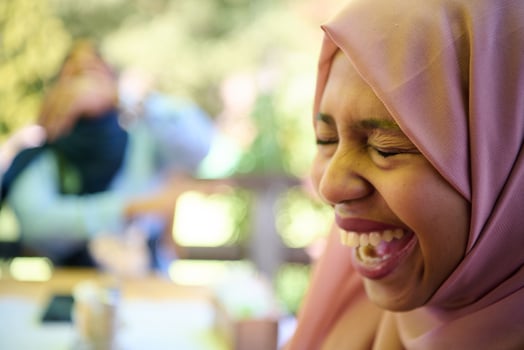 Close up Portrait of a Joyful Middle Eastern Hijabi photo