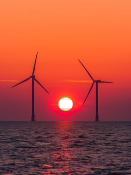 A landscape of a wind farm, symbolizing green energy and sustainability. photo