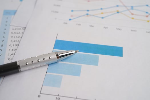 Pen on chart graph paper. Finance, account, statistic, investment data economy, stock exchange business. photo
