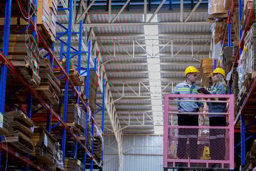 workers man and woman using a hydraulic scissor lift to check stock near the shelves warehouse. industry factory warehouse. Worker Screening Package In Warehouse. photo